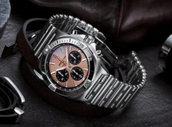 The black sub-dials are in contrast to the salmon dial.